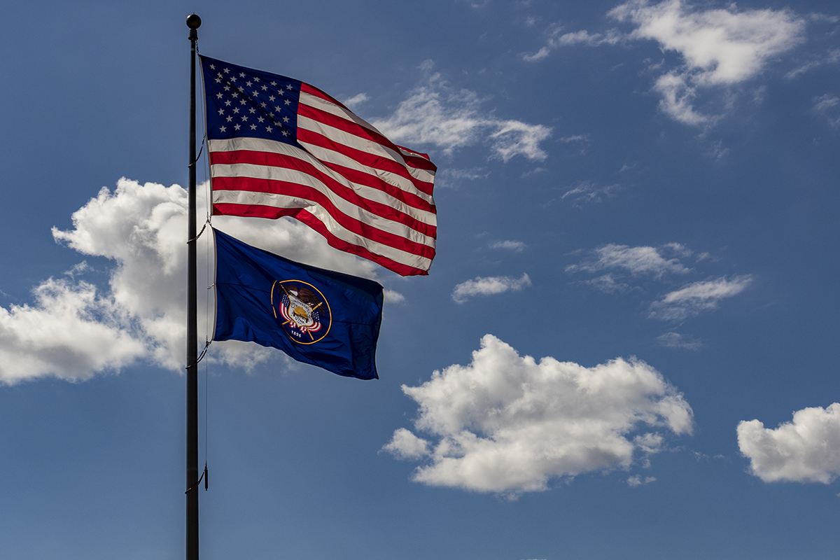The U.S. and Utah flag, flowing in the wind
