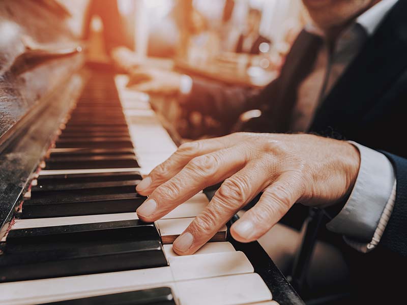 Fingers on a piano