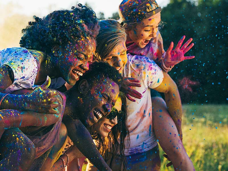Friends smiling at the color festival